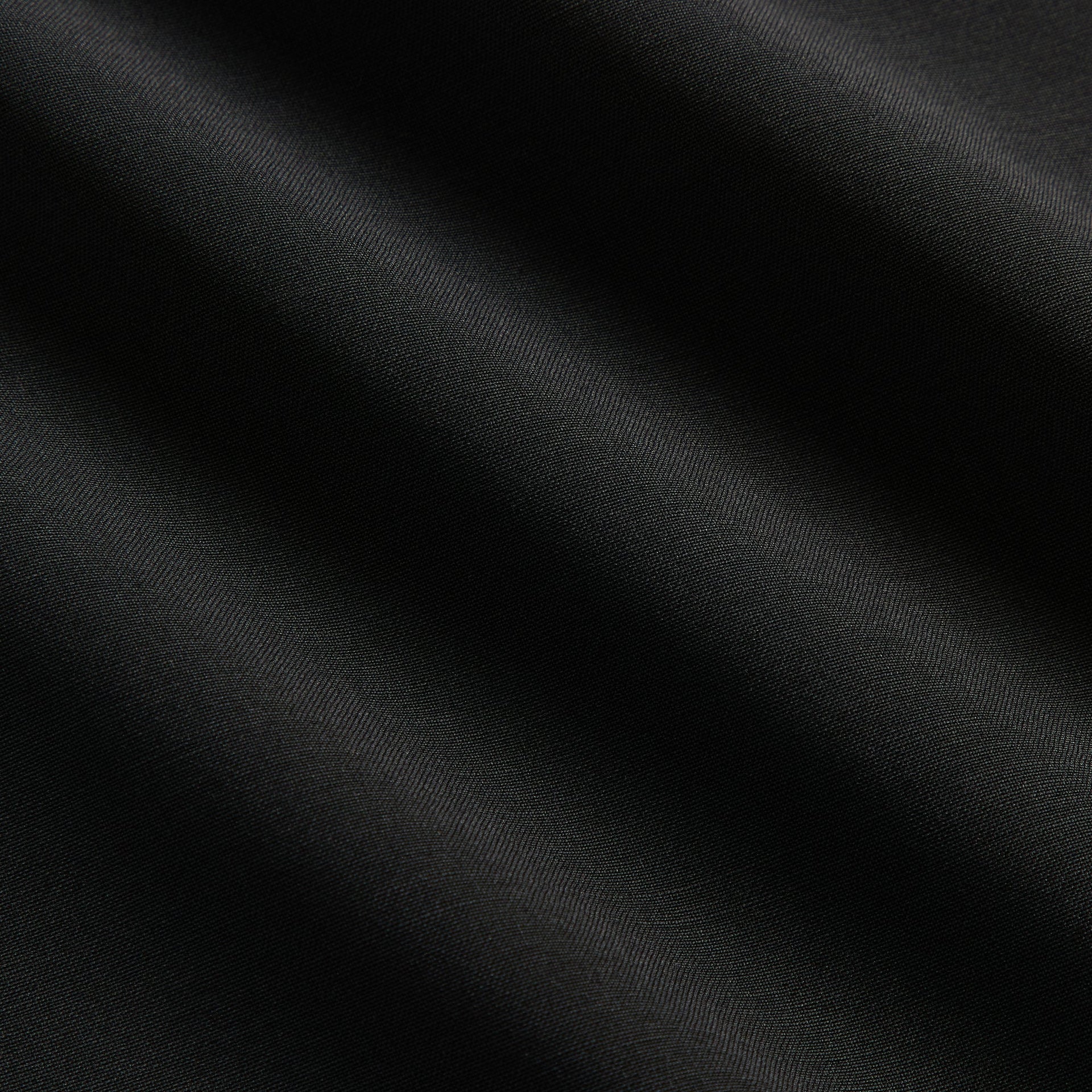 &Kin Eli Pleated Trouser close-up of the black tropical wool fabric weave