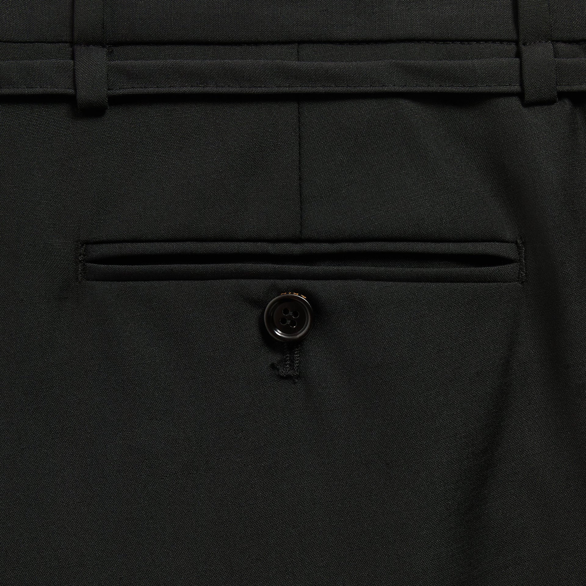 &Kin Eli Pleated Trouser detail, buttoned welt back pocket and belt loops in Black tropical wool
