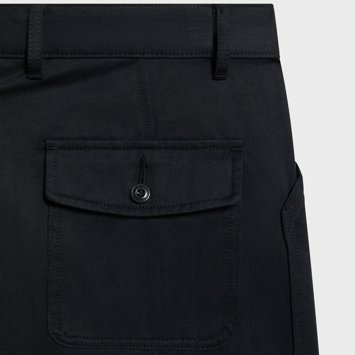 Kith Washed Herringbone Twill Gus Pant in black, back detail close-up of button flap pocket and belt loops