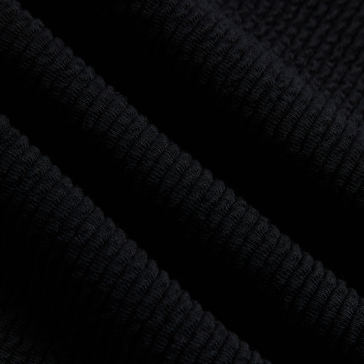 Kith Heavy Crepe Elmhurst Pant, close-up of the black ribbed crepe fabric texture
