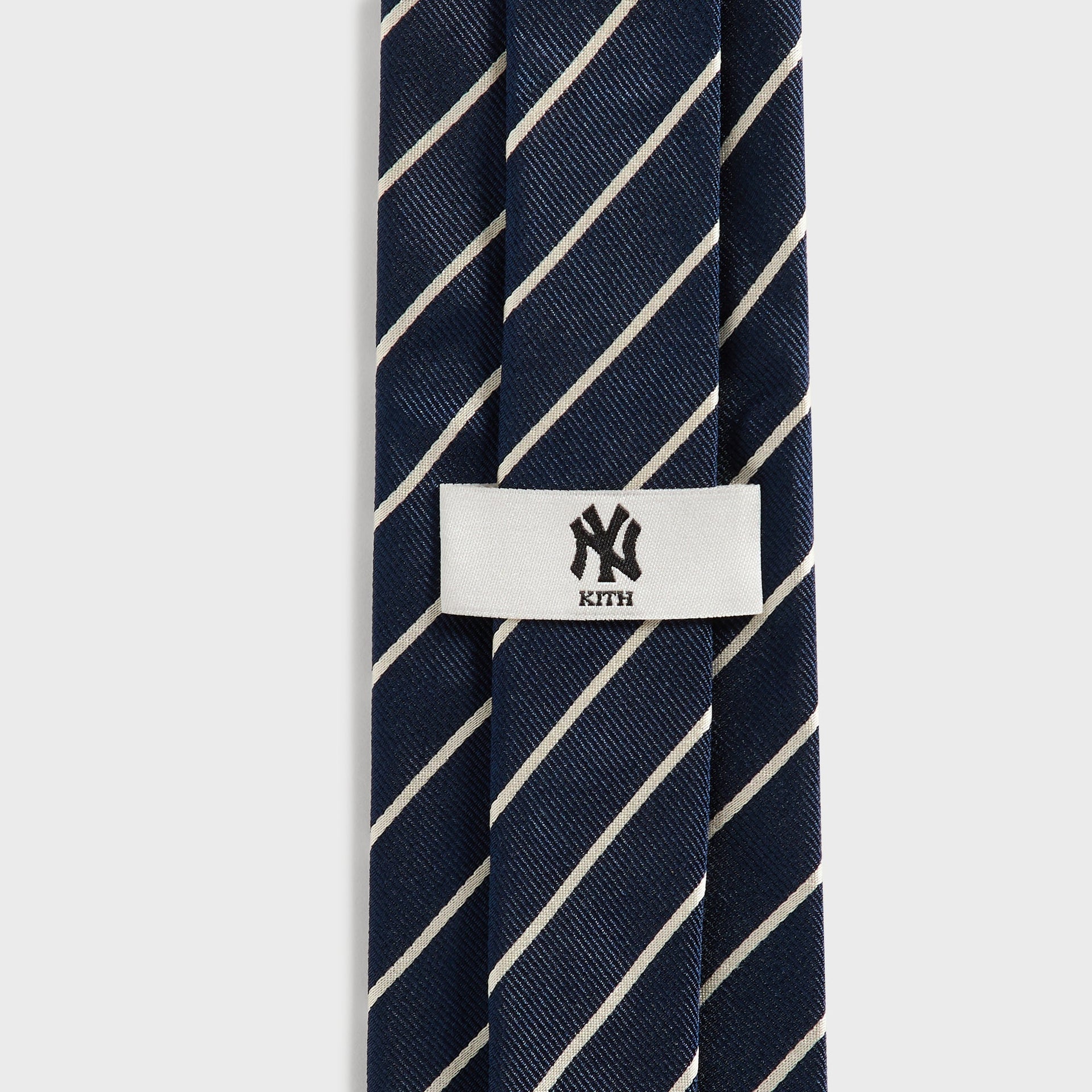 Kith x New York Yankees Nocturnal tie, close-up of woven NY Kith keeper loop label