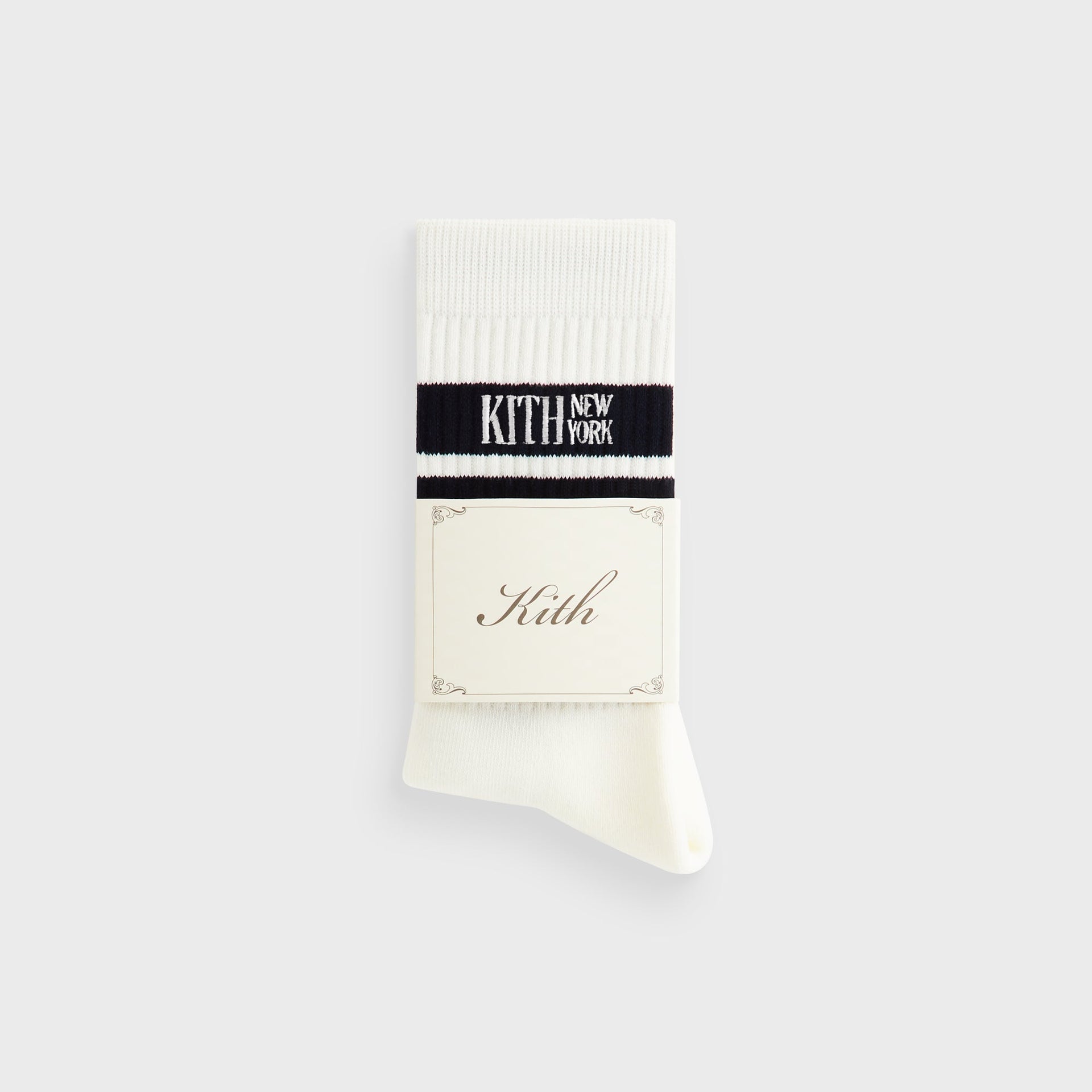 Kith Calf Stripe Socks in Silk folded pair banded with Kith New York cardstock wrap, packshot
