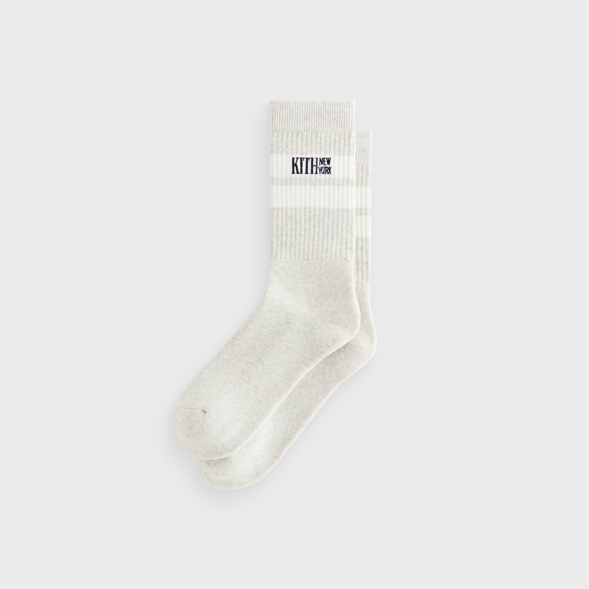 Kith Calf Stripe Socks in Heather Grey, flat lay pair showing the white stripe band and Kith New York logo at the calf.