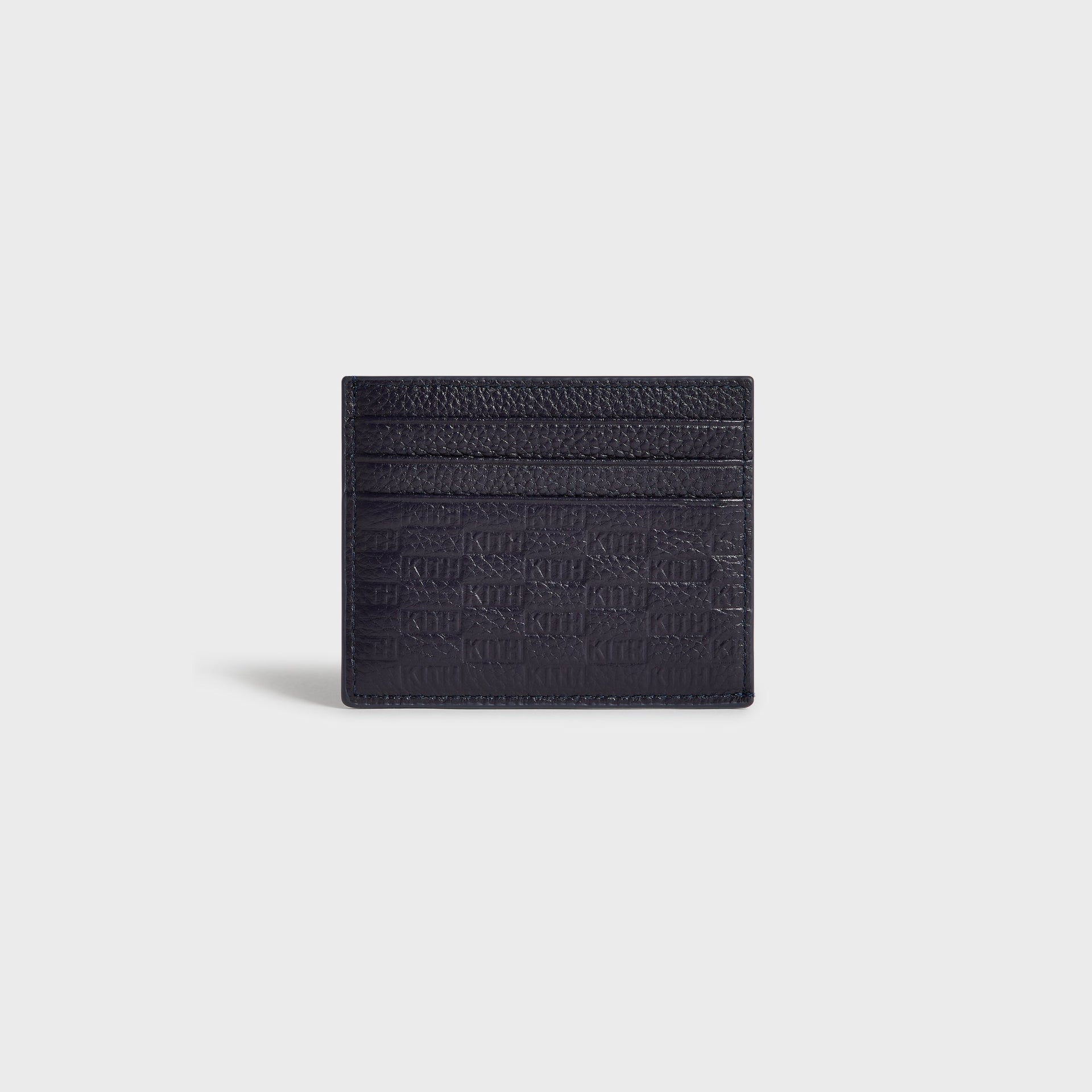 Kith Monogram Tumbled Leather Card Holder in Ink, straight-on view highlighting tumbled leather texture