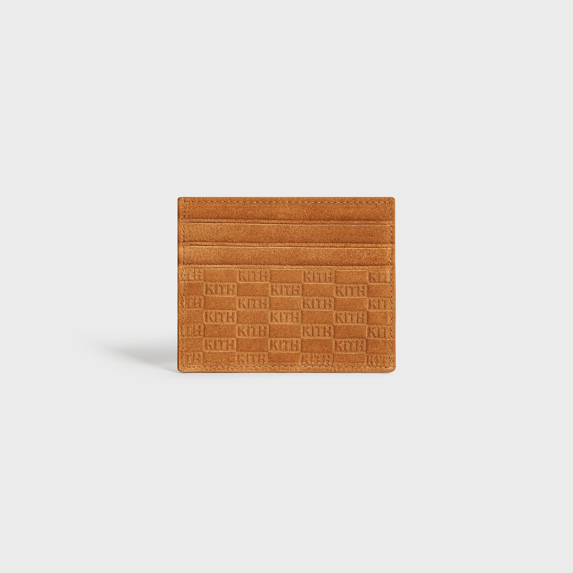Straight-on view of the Kith Monogram Suede Cardholder in Argil highlighting the embossed logo texture