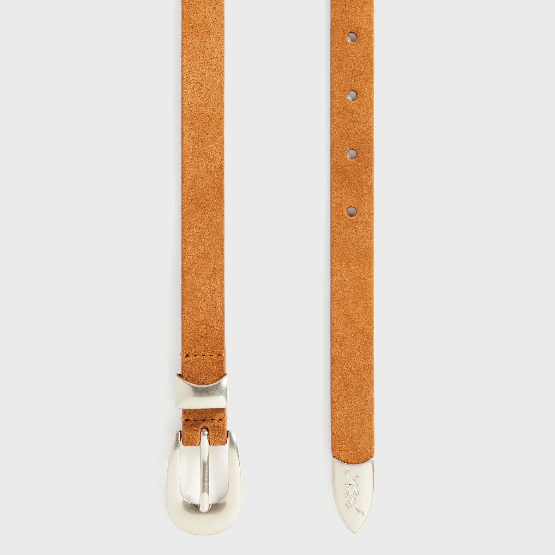 Flat lay of the Kith Western Suede Belt in Argil showing the buckle end with adjustment holes and the silver-tipped strap end