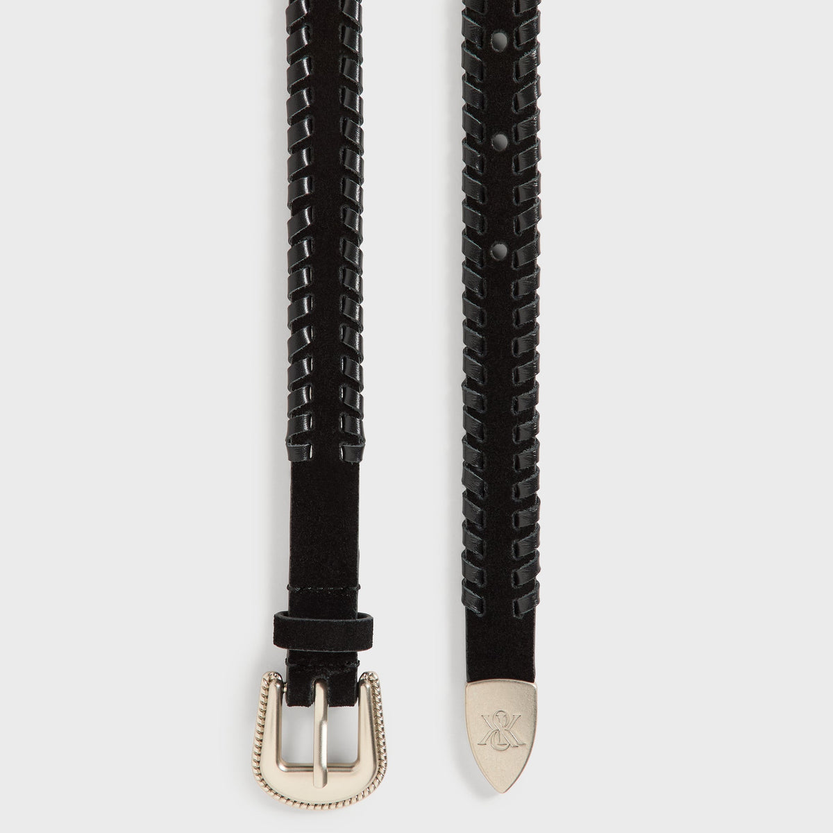 Kith Braided Edge Belt in black, buckle and tip laid flat showing braided edge and silver tip