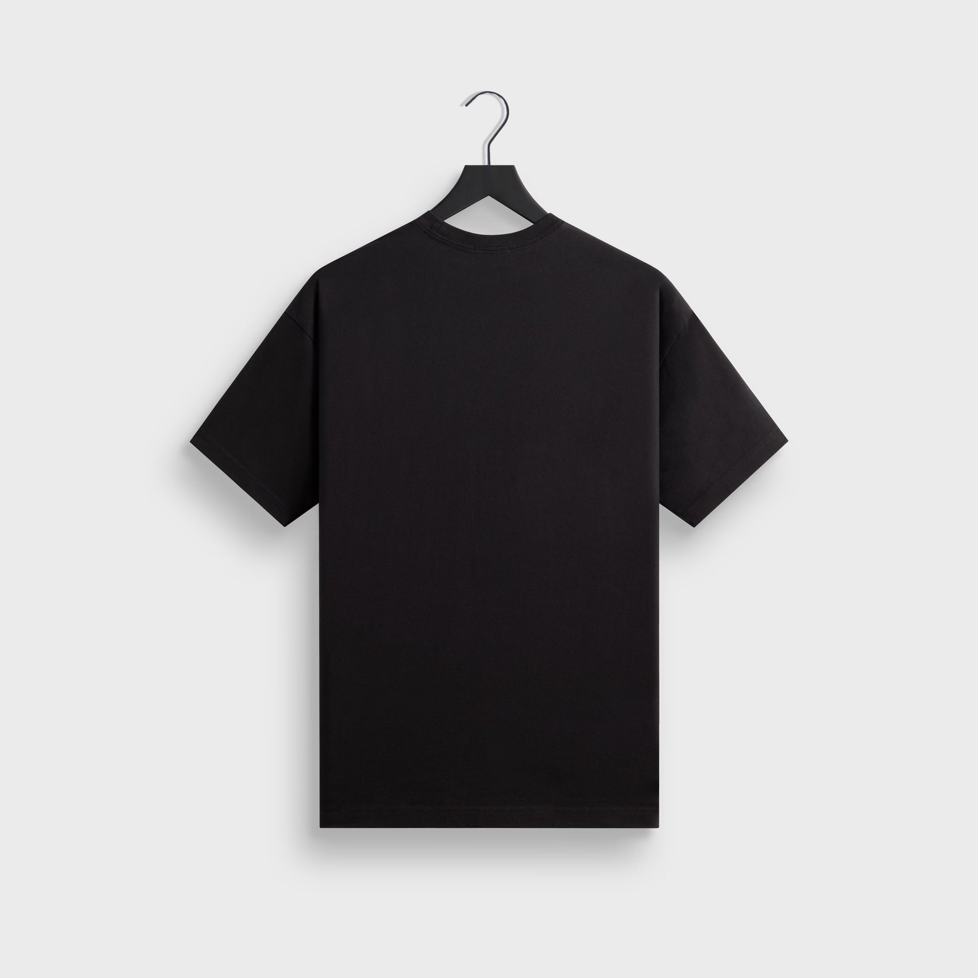 Back of the plain black Kith for Cinelli Upside Down Tee on a Kith hanger, no graphic