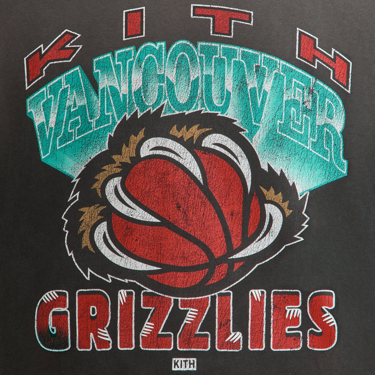 Close-up of distressed Kith Vancouver Grizzlies basketball claw graphic on the faded black Vintage Jones II tee