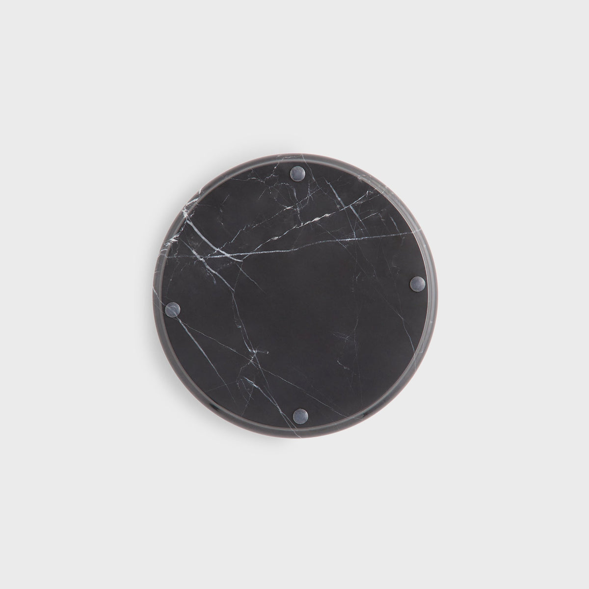 Kith Marble Catchall Tray in black marble, underside view of round base with four small round feet