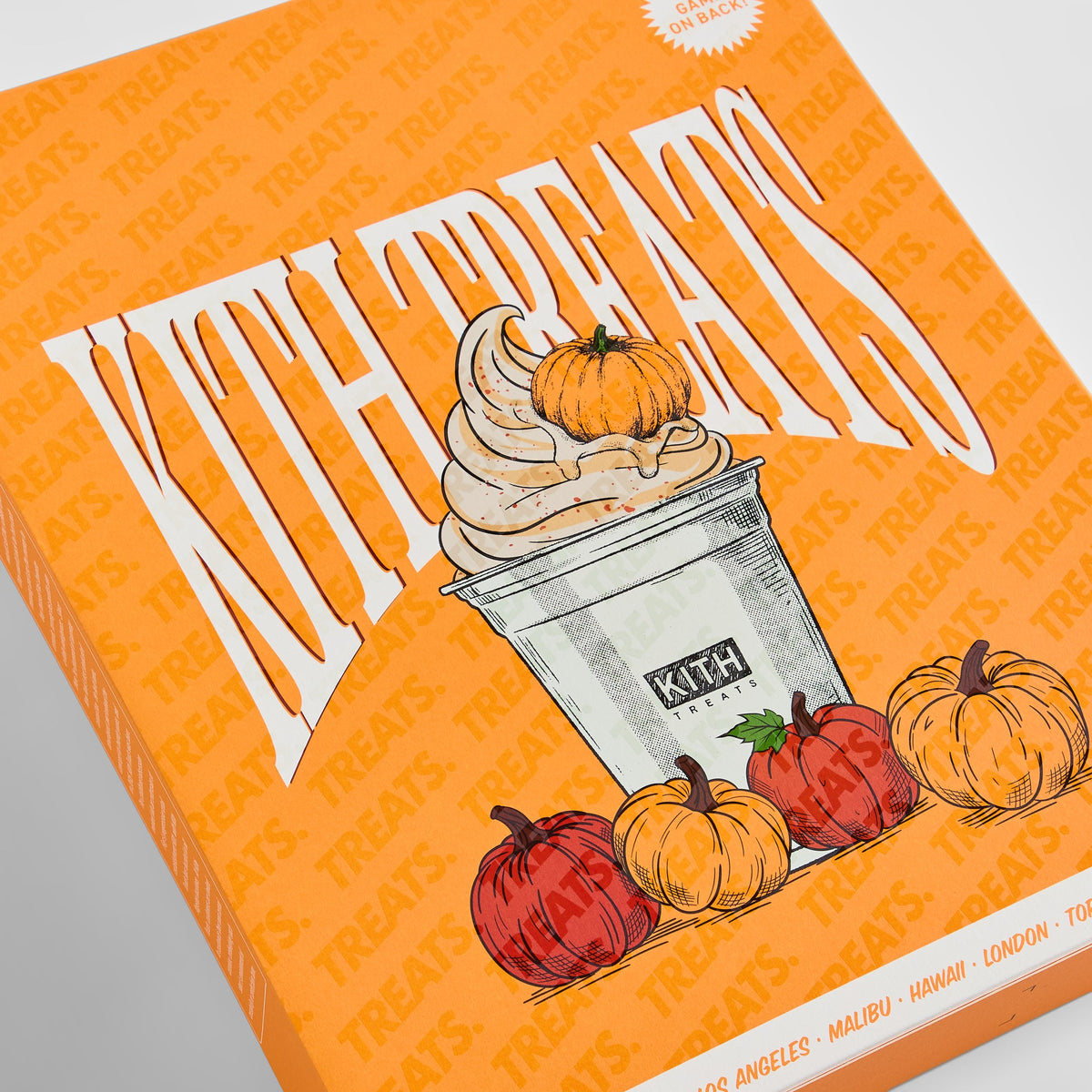Angled close-up of Kith Treats Pumpkin Harvest box front showing Kith Treats lettering, soft-serve cup and red and orange pumpkins