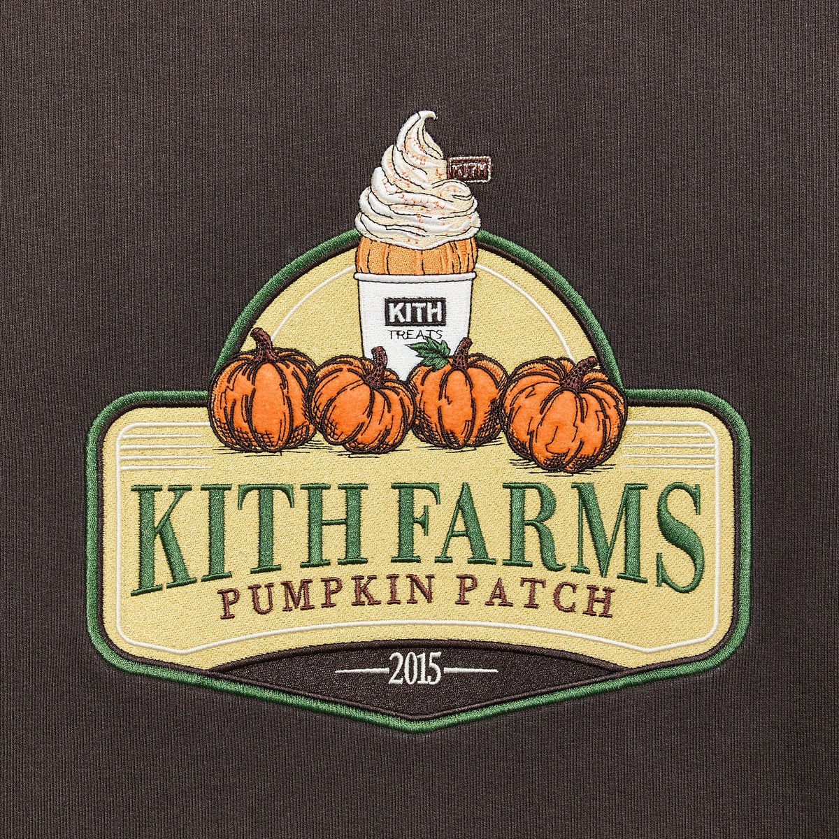 Close-up of Kith Farms Pumpkin Patch 2015 embroidered patch with pumpkins and soft-serve cup on Kindling Nelson Crewneck