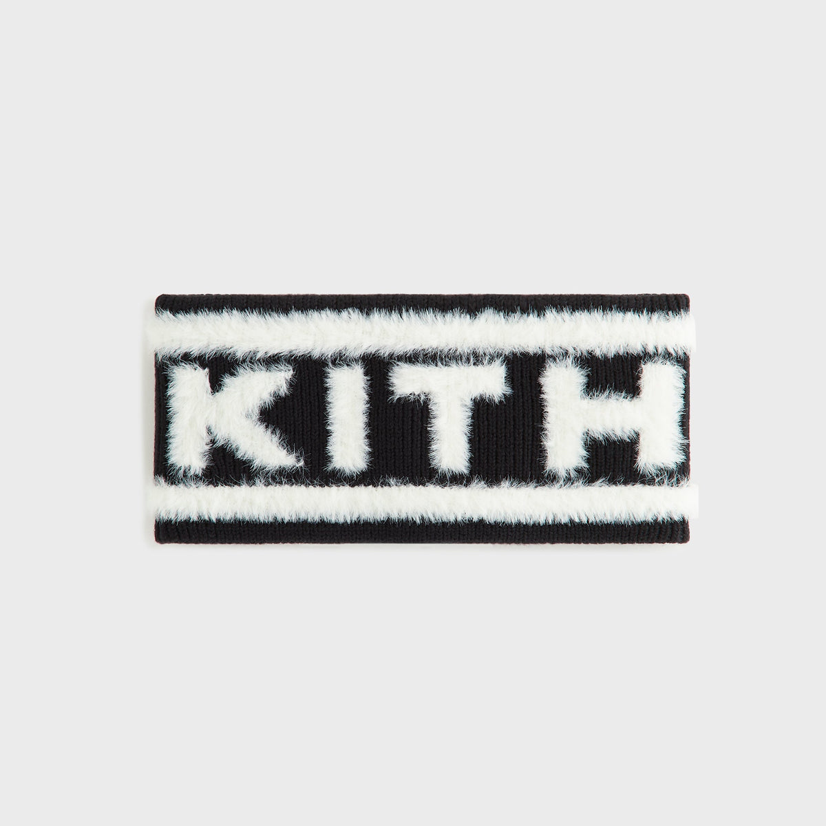 Kith Jacquard Rib Headband in black with white fuzzy 'KITH' lettering, flat lay front view