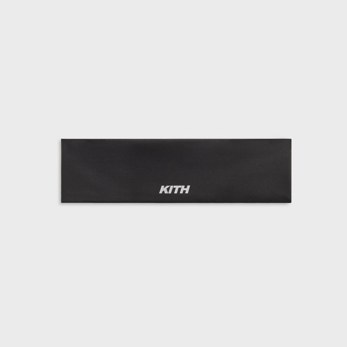 Kith Women's Active Headband in black with white Kith wordmark, flat lay front