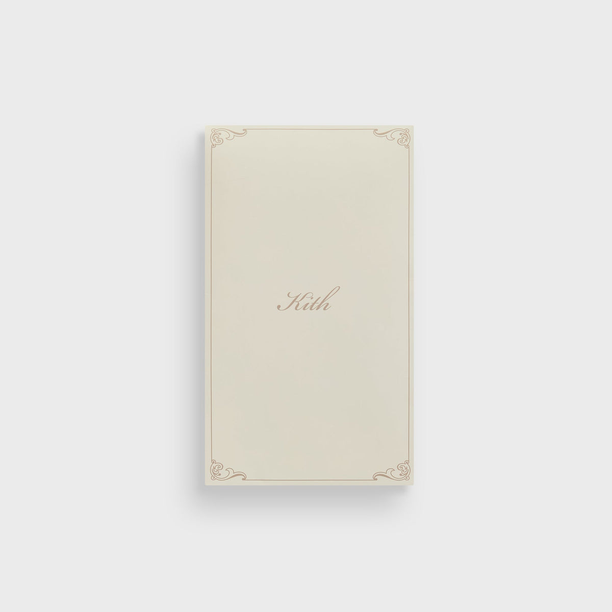 Kith branded packaging card in cream with gold scroll border and 'Kith' script logo