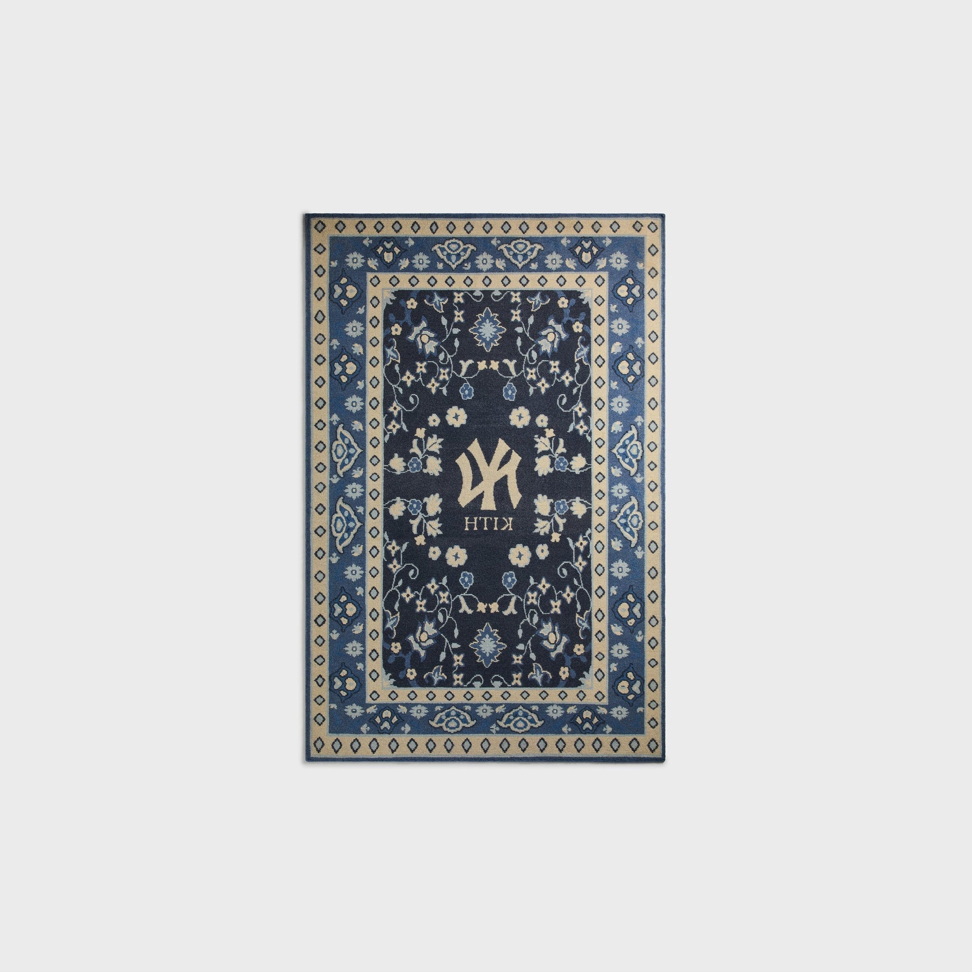 Kith & Kasra Rugs NY Yankees 3x5 rug in Nocturnal, reverse-side view showing mirrored Yankees logo and KITH text