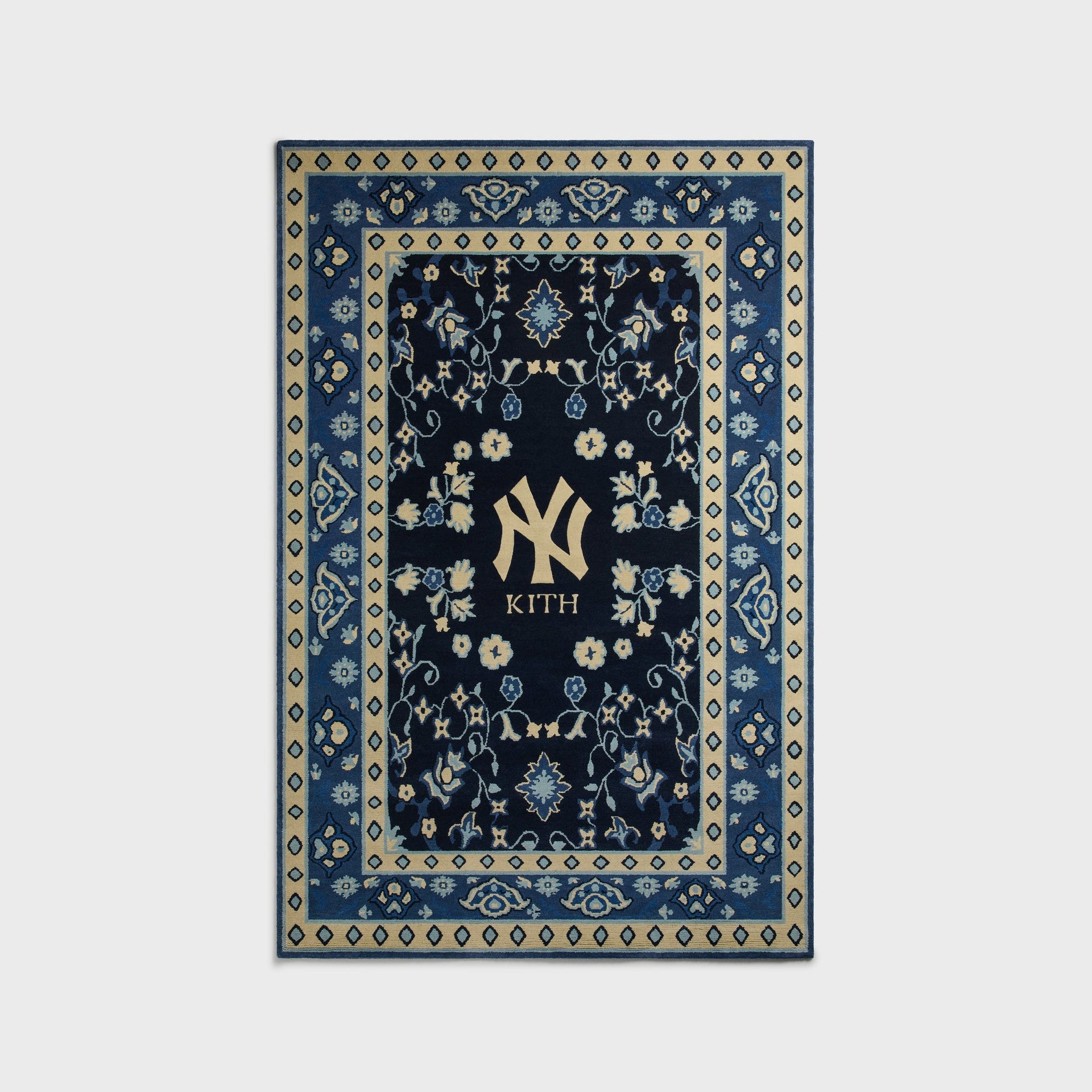 Kith & Kasra Rugs NY Yankees 5x8 hand-knotted rug in Nocturnal navy, front view with cream diamond border