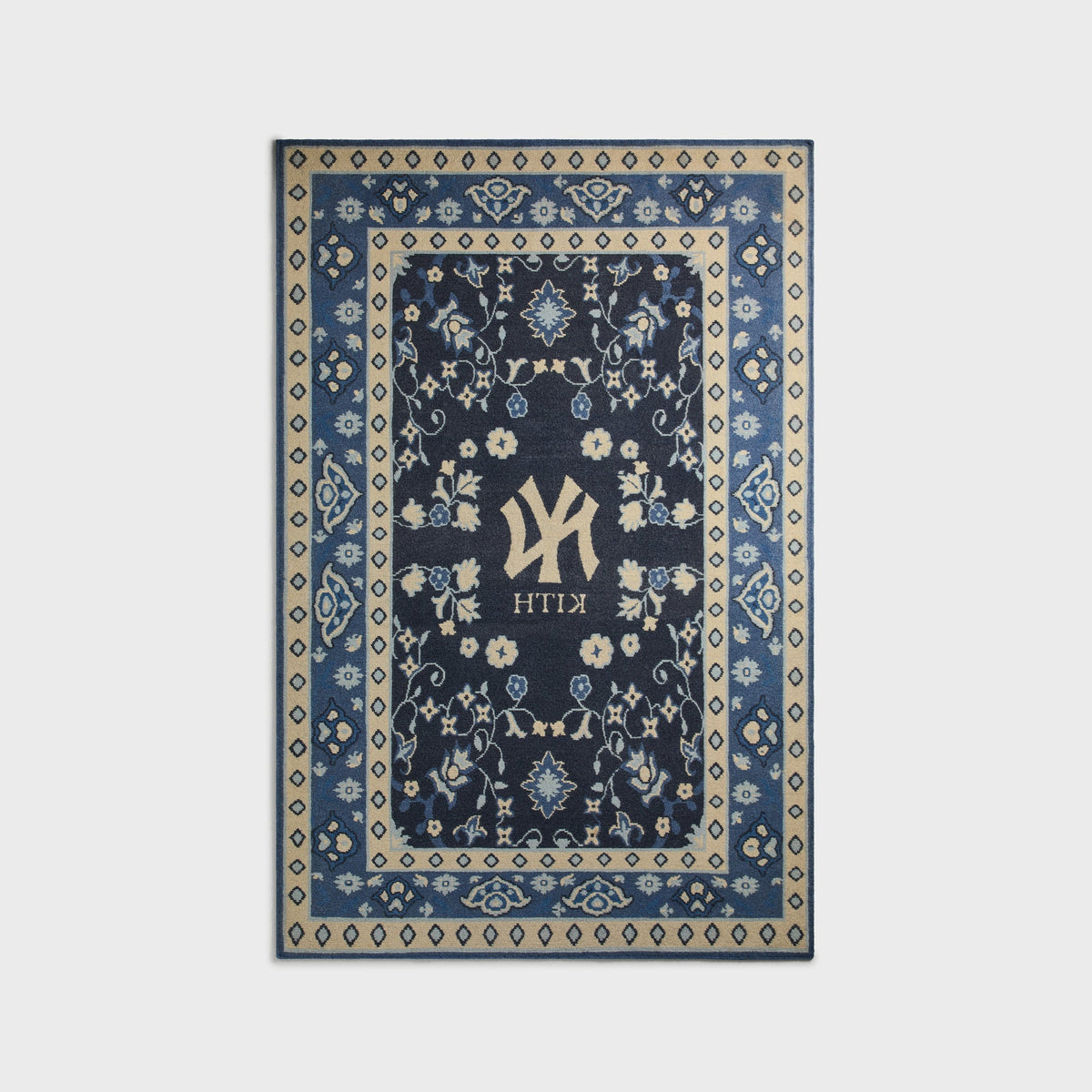 Kith & Kasra Rugs NY Yankees 5x8 rug in Nocturnal, reverse-side view showing mirrored Yankees logo and KITH text