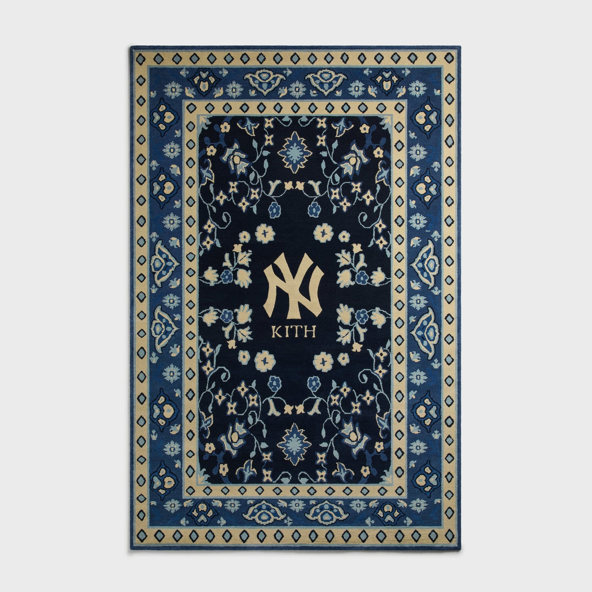 Kith & Kasra Rugs NY Yankees 8x10 hand-knotted rug in Nocturnal navy, front view with cream diamond border