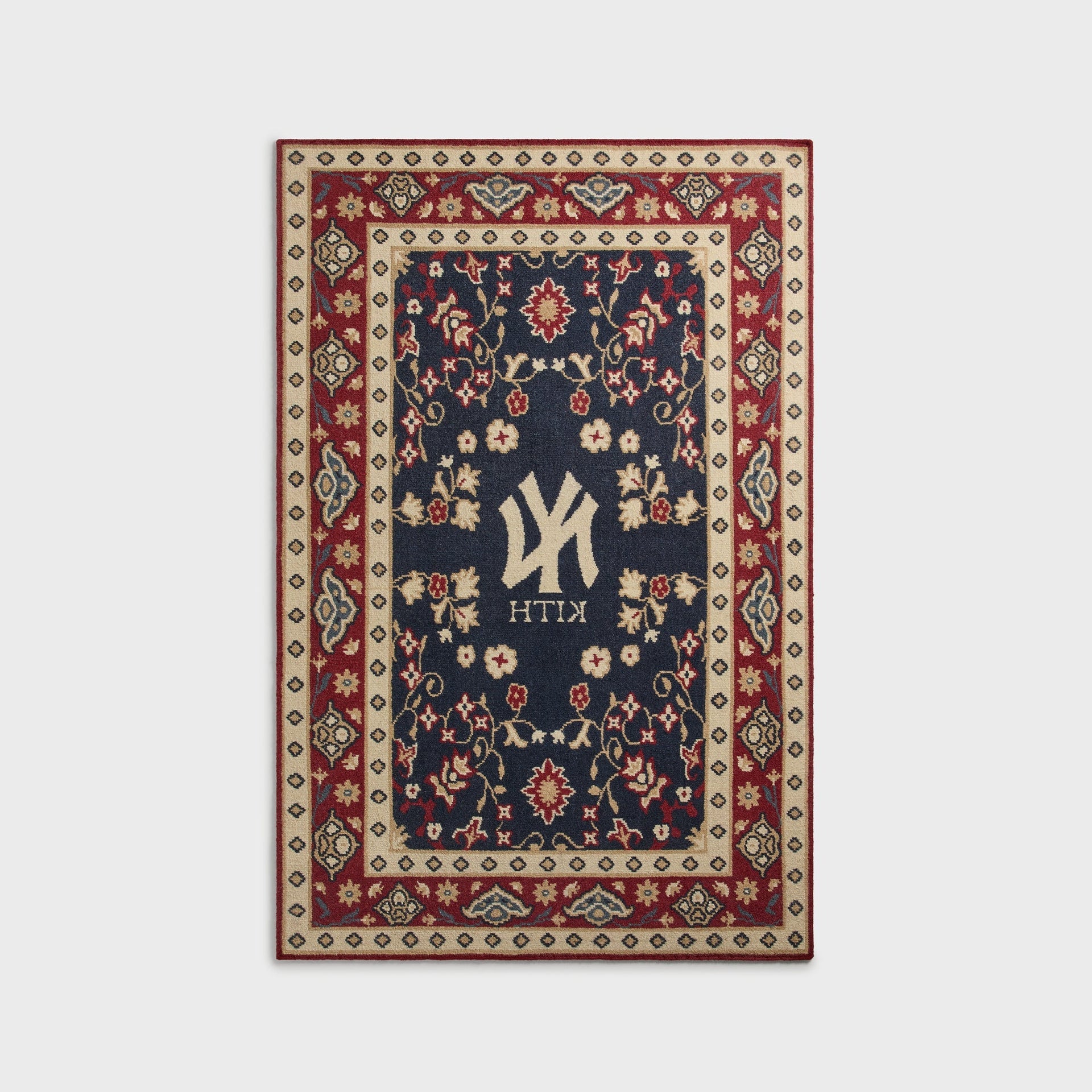 Kith & Kasra Rugs NY Yankees 5x8 rug in Multi, reverse-side view showing mirrored Yankees logo and KITH text