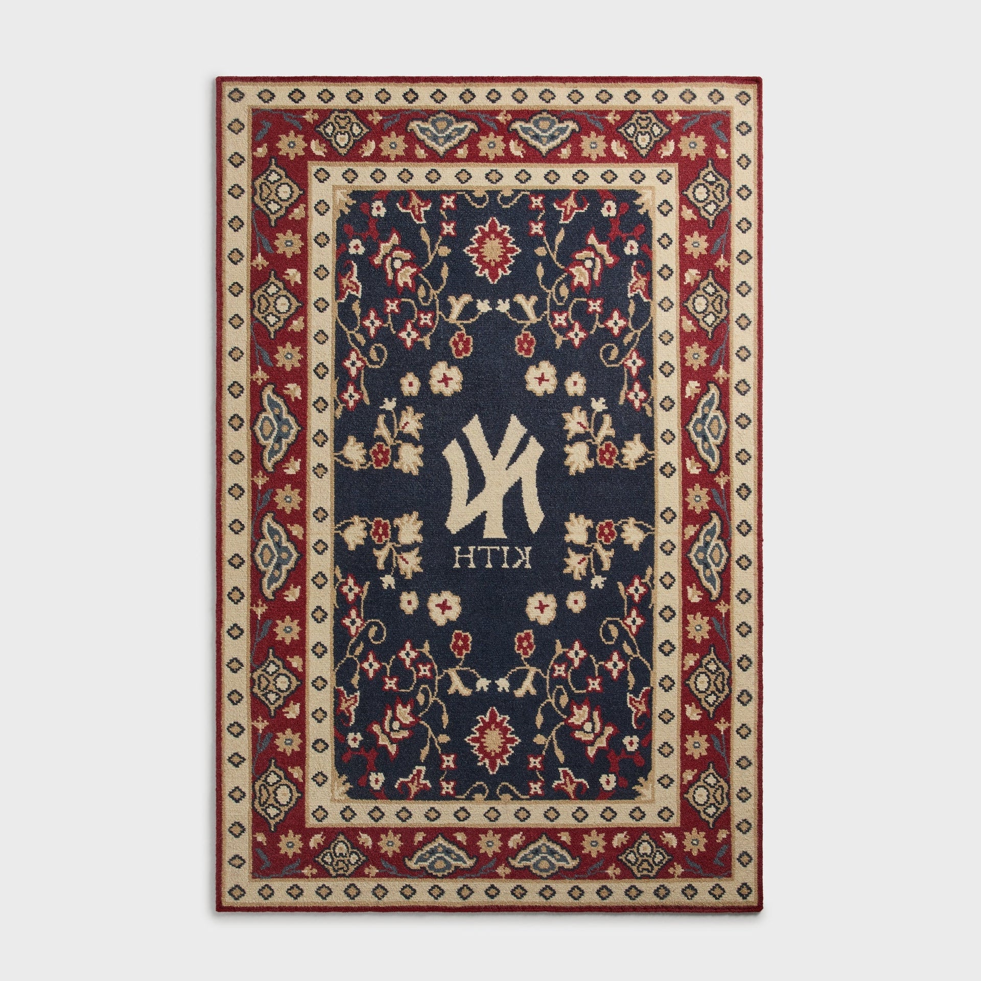 Kith & Kasra Rugs NY Yankees 8x10 rug in Multi, reverse-side view showing mirrored Yankees logo and KITH text