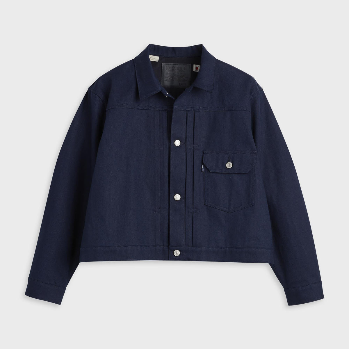 Levi's Blue Tab Type I Selvedge Denim Trucker Jacket in rigid dark wash, cropped front with chest pocket and pleats