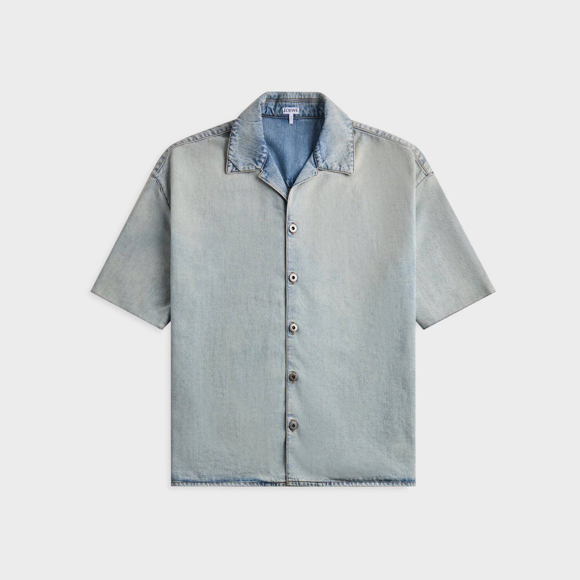 Loewe Anagram denim shirt in washed light blue, front view with camp collar and engraved Loewe metal buttons