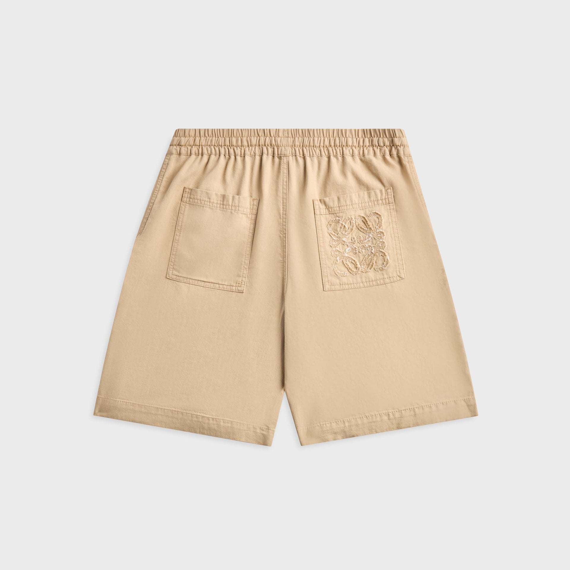 Loewe beige cotton shorts, back view with two patch pockets and tonal Anagram embroidery on right pocket