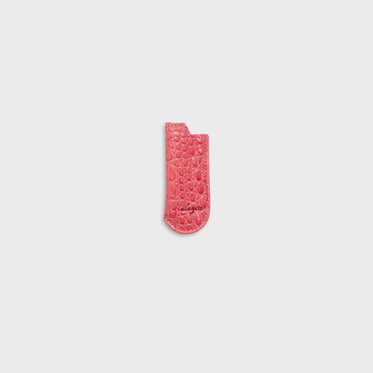 Malagon croc lighter cover in pink, alternate view with croc texture and Malagon script