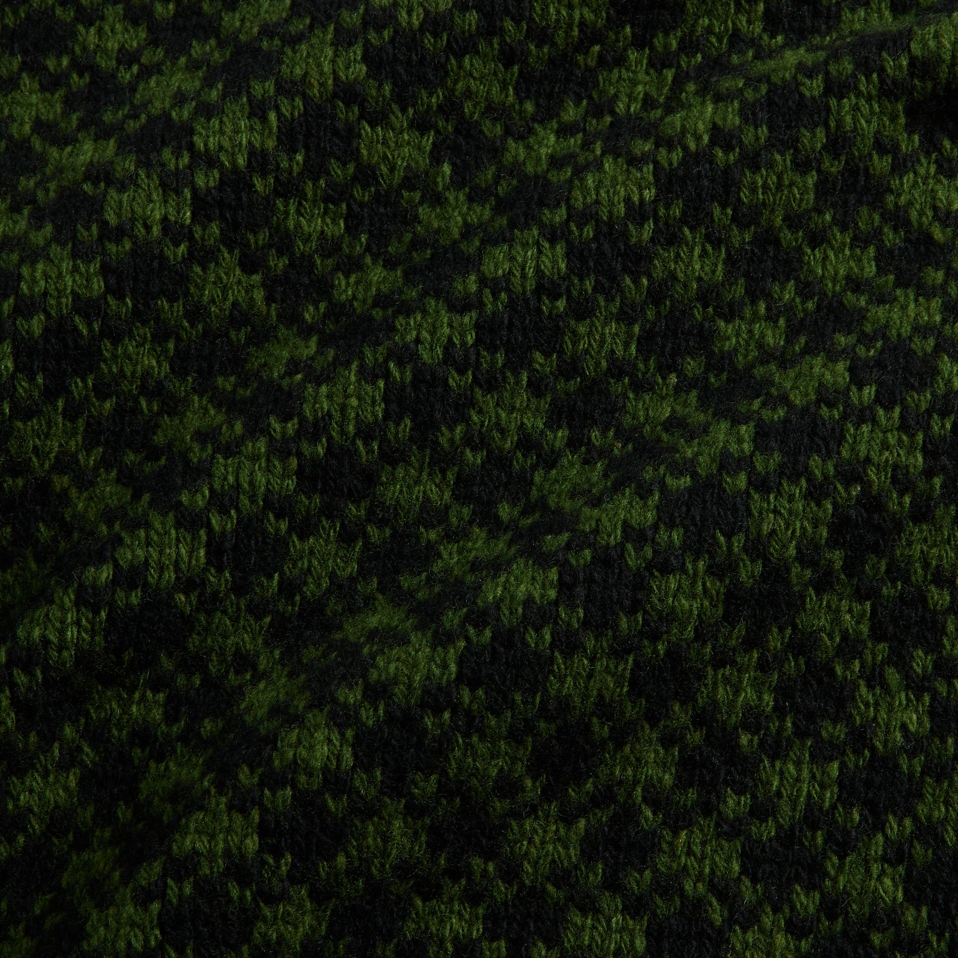 Marni green wool jumper fabric detail, close-up of green and black houndstooth knit texture