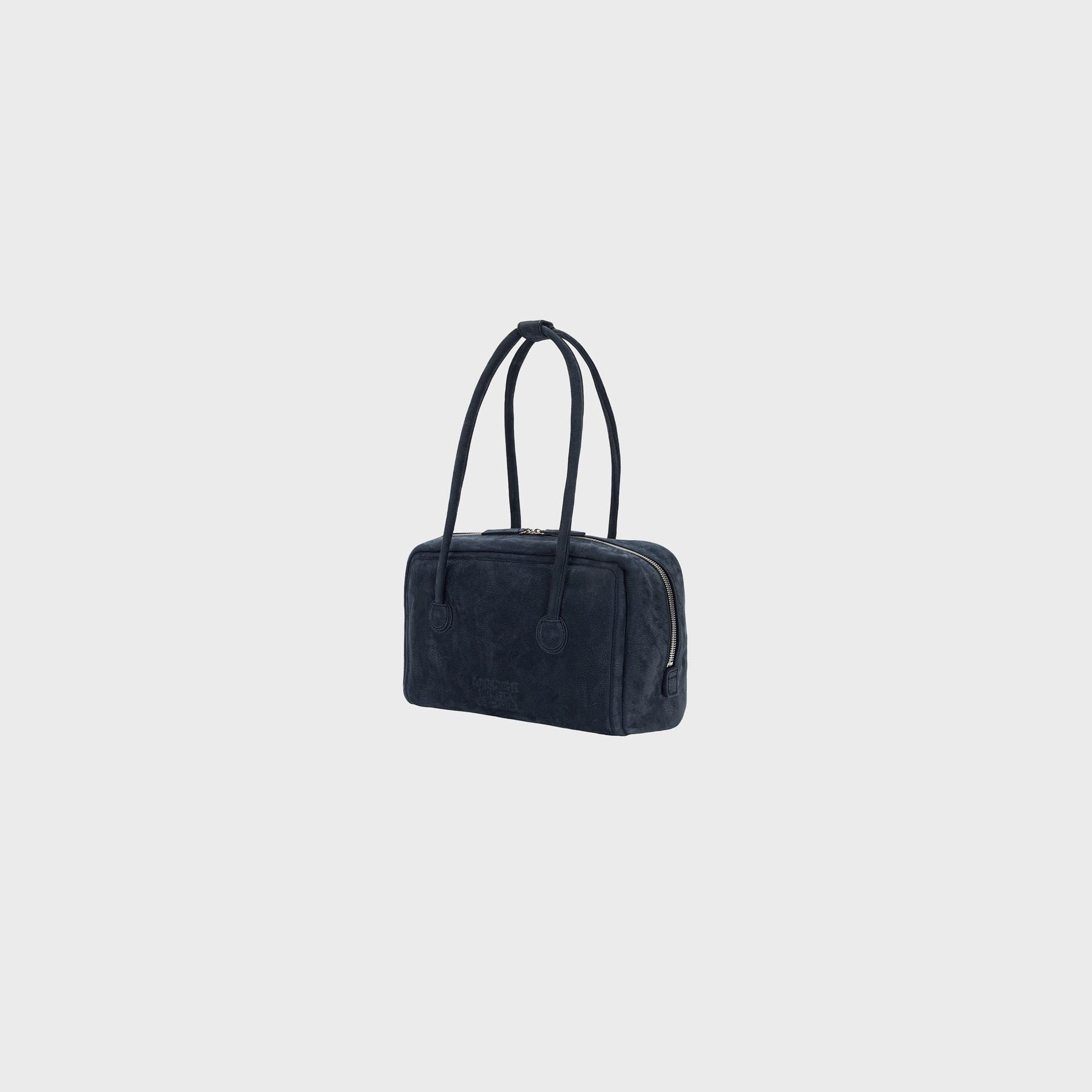 MARGESHERWOOD indigo nubuck Boston bag, three-quarter view showing silver zip and rounded gusset