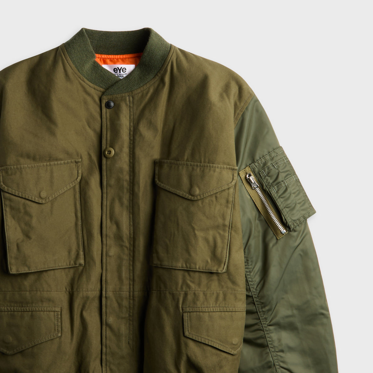 Comme des Garçons eYe Junya Watanabe MAN olive cotton bomber jacket with flap pockets and nylon sleeve zip pocket