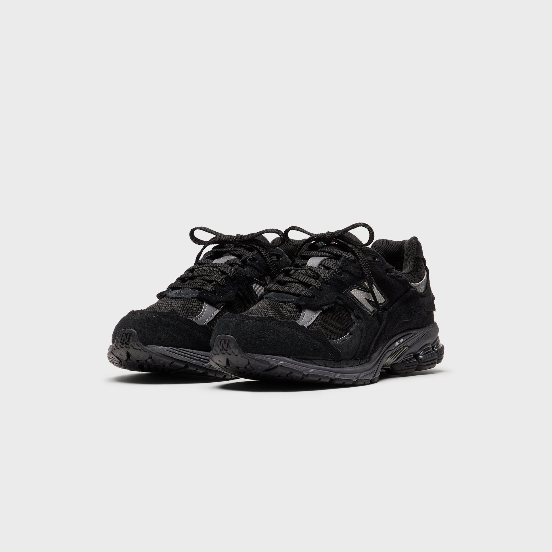 New Balance U2002DX - Black / Magnet