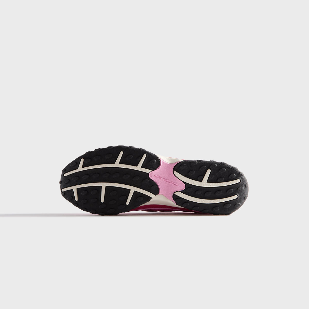 Kith & New Balance 204L in Camellia, bottom view of the black and pink rubber outsole tread