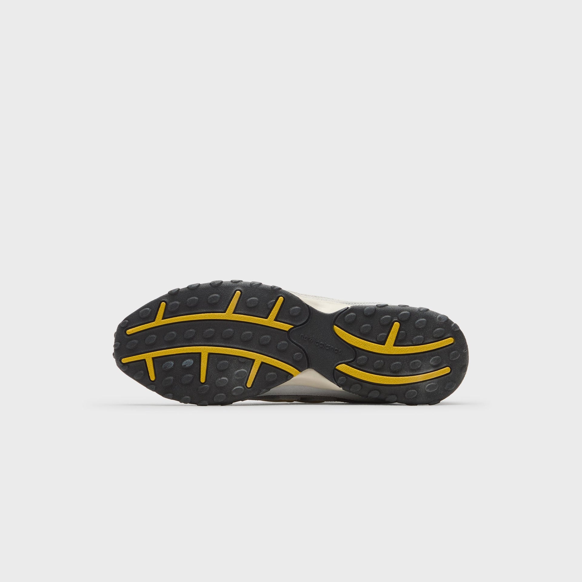 Kith x New Balance 204L sneaker outsole, black rubber tread with yellow trail lugs