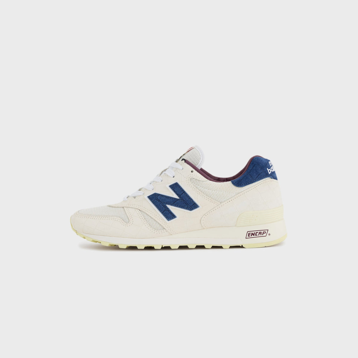 New Balance Made in USA 1300 sneaker in Angora with Blue Oyster suede accents, opposite side profile view