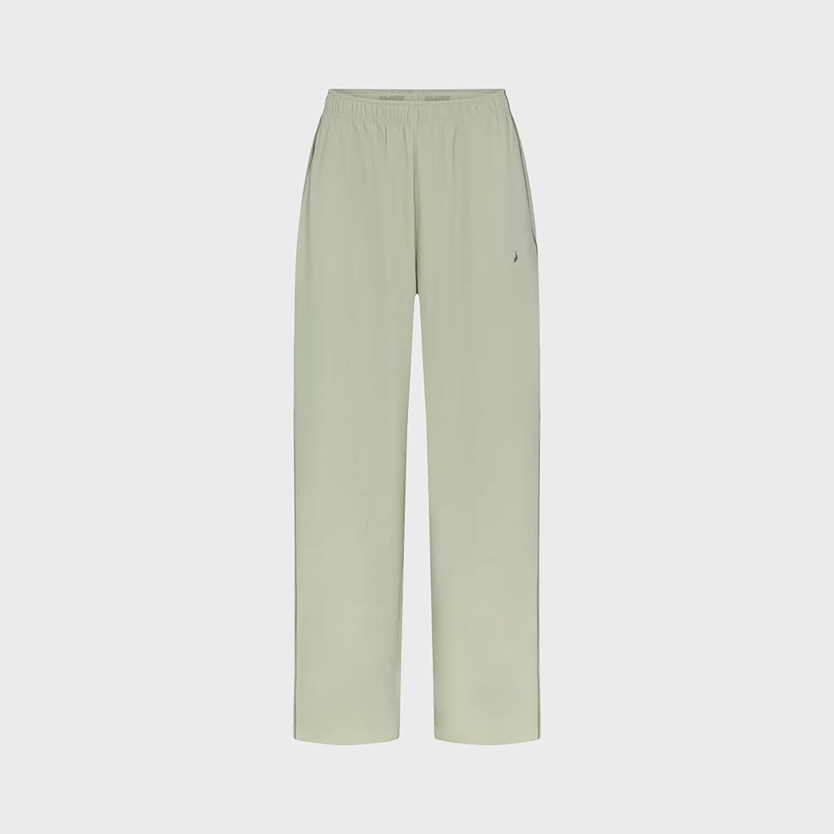 NikeSKIMS Stretch Nylon Oversized Pant in Talc, pale sage wide-leg trouser with elastic waist and small Swoosh logo