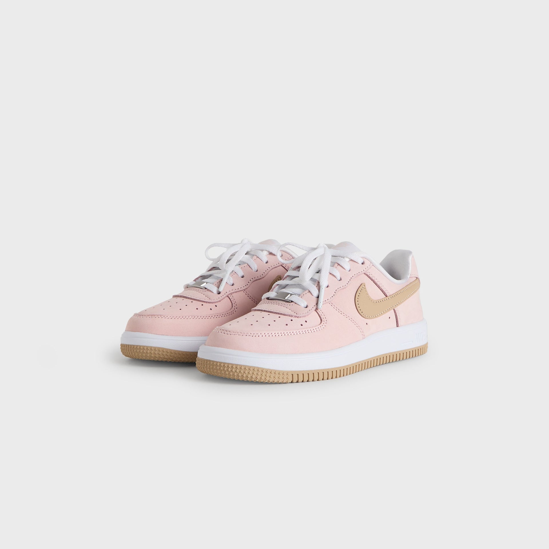 Kith Kids x Nike PS Air Force 1 Un-Linen in pink, angled front three-quarter view of the pair with white laces and wheat Swoosh