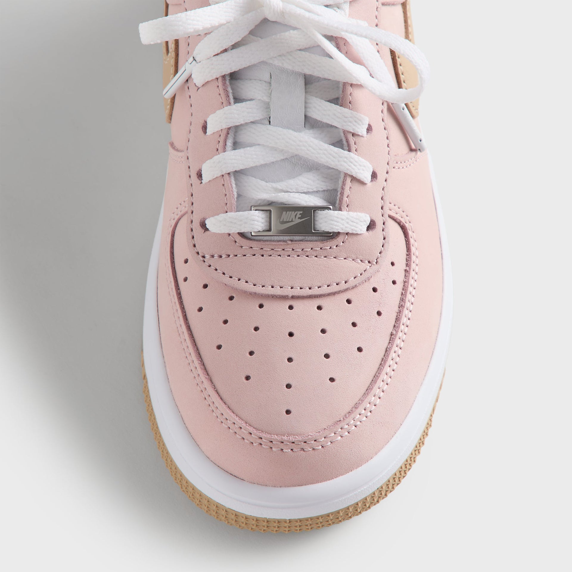 Close-up of the Kith Kids x Nike PS Air Force 1 Un-Linen toe box, wheat suede Swoosh and gum sole