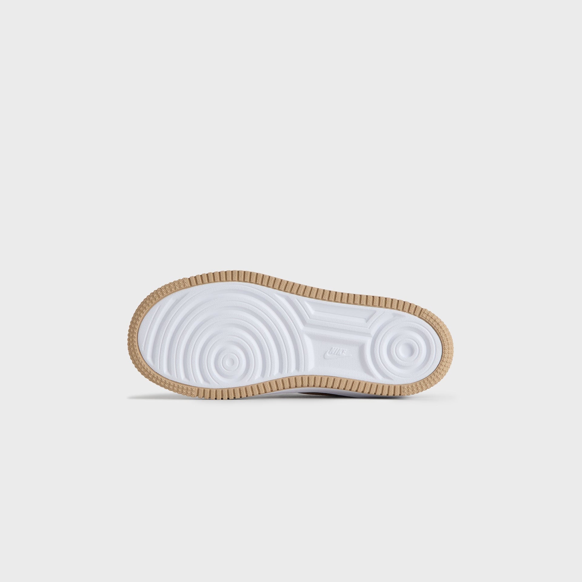 Gum rubber outsole of the Kith Kids x Nike PS Air Force 1 Un-Linen, seen from below