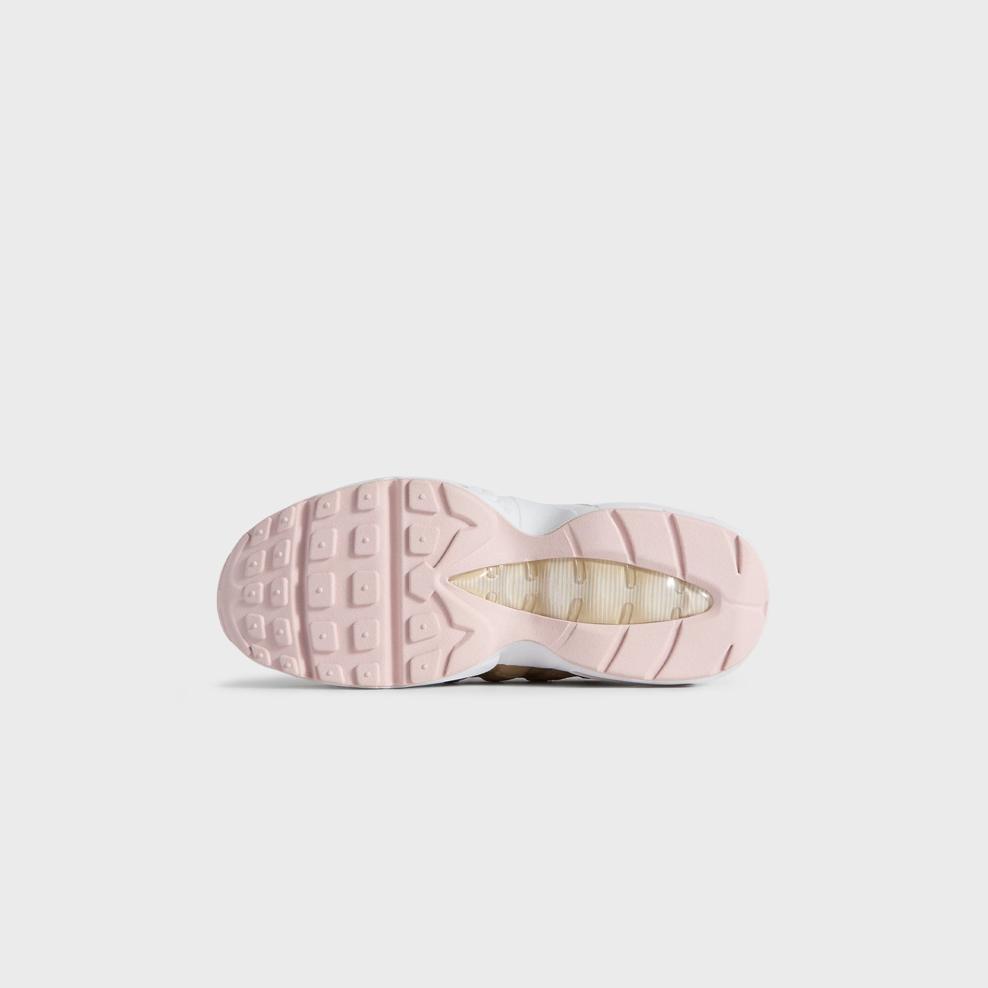 Translucent pink outsole of the Kith Kids x Nike PS Air Max 95 Linen, seen from below
