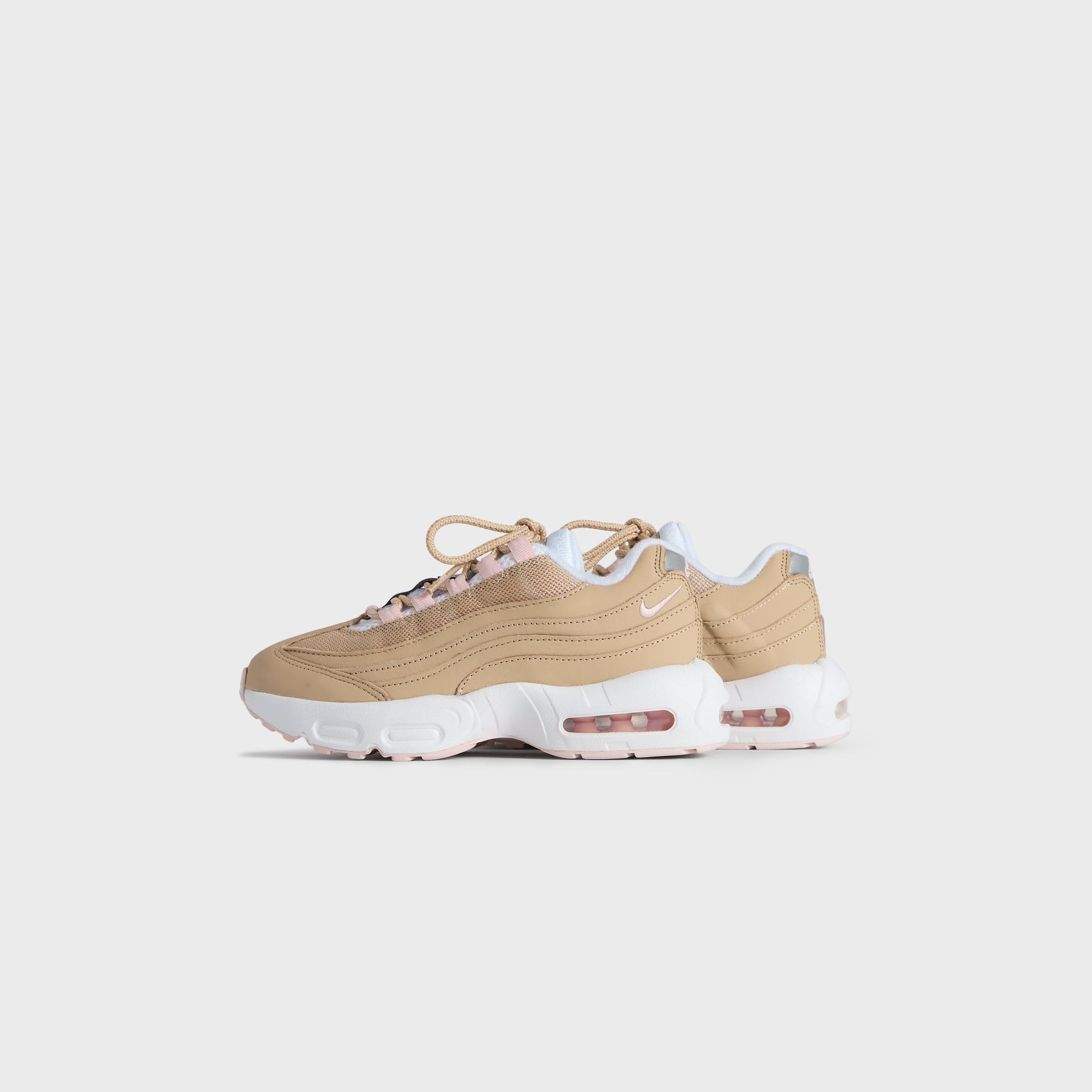 Kith Kids x Nike PS Air Max 95 Linen pair, small front three-quarter angle in wheat linen with pink