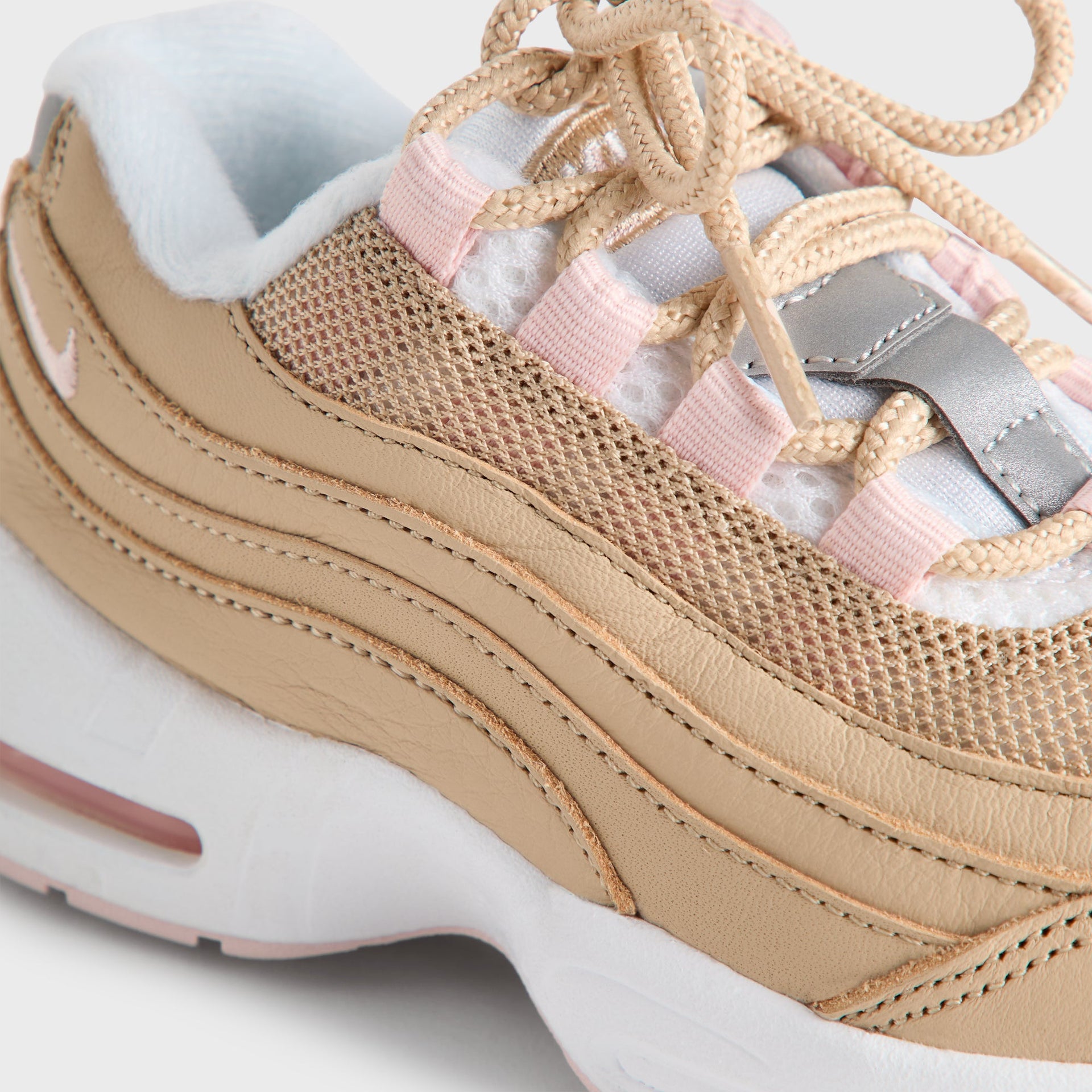 Rear detail of the Kith Kids x Nike TD Air Max 95 Linen, pink Air unit and wheat mesh heel (additional studio view)