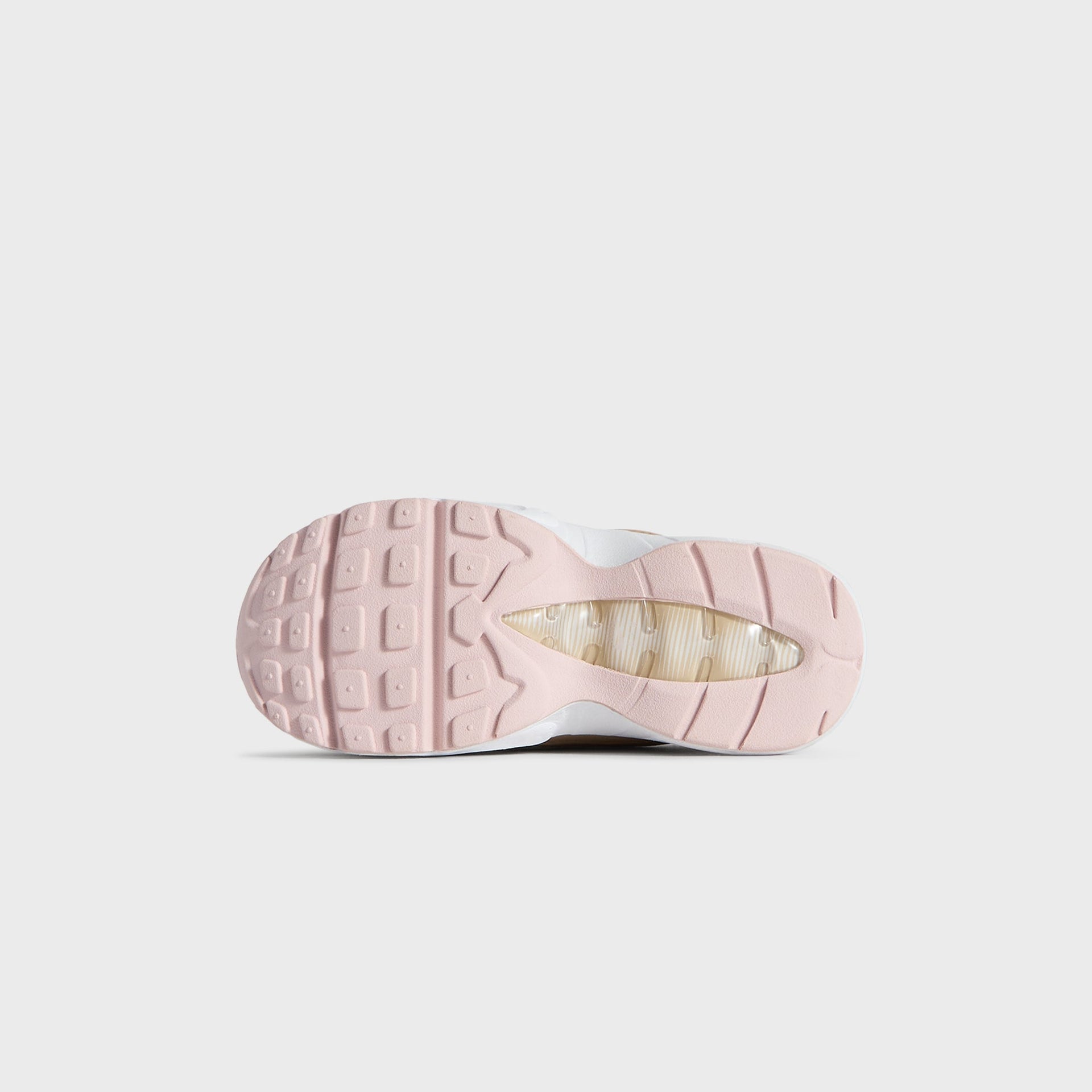 Translucent pink outsole of the Kith Kids x Nike TD Air Max 95 Linen, seen from below (additional studio view)