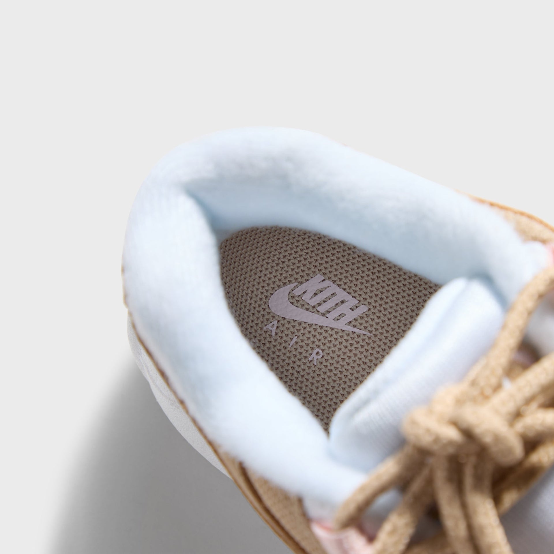 Footbed of the Kith Kids x Nike TD Air Max 95 Linen with Kith insole branding and blue lining