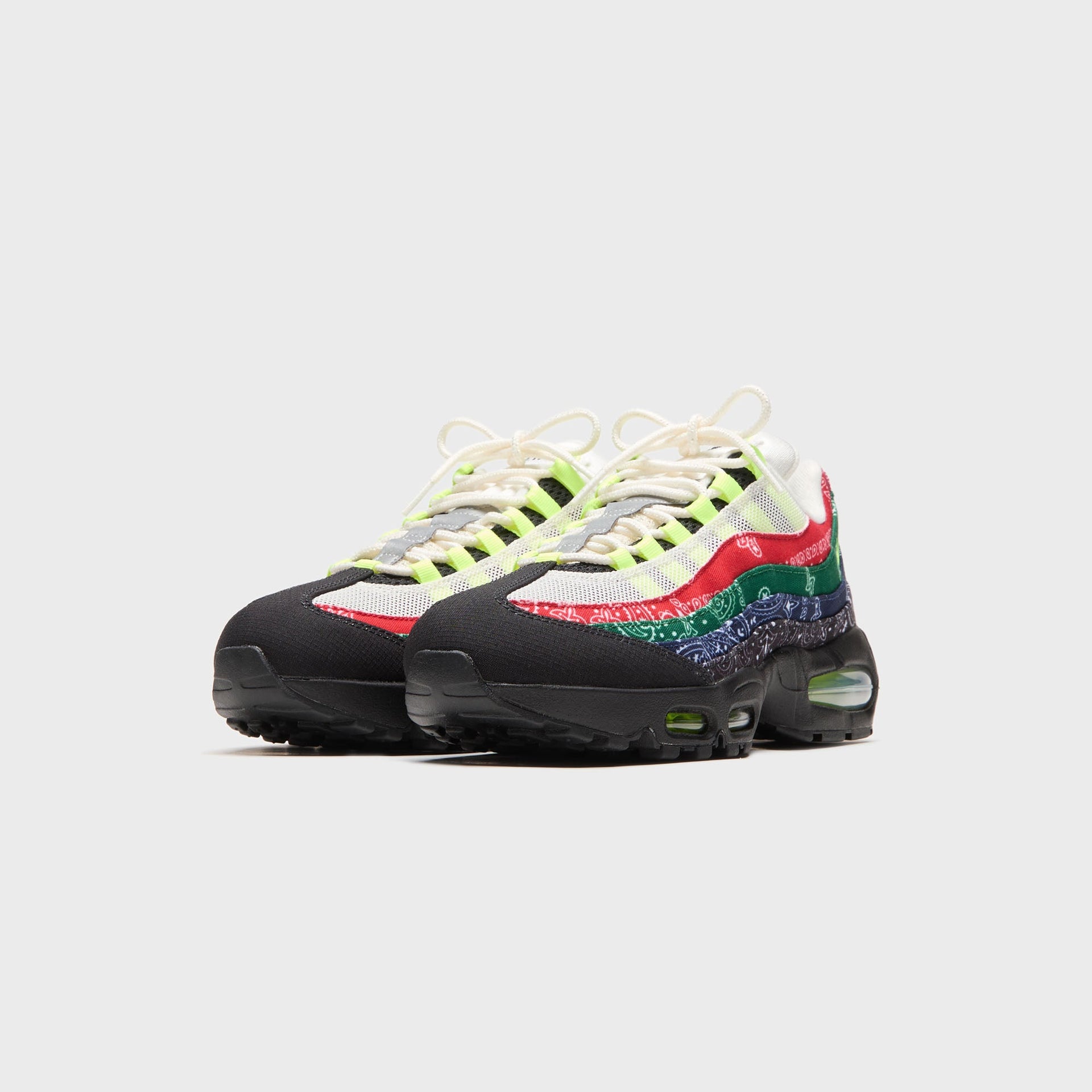 Kith x Nike Air Max 95 bandana, front view of the pair showing paisley panels, volt laces and black toe