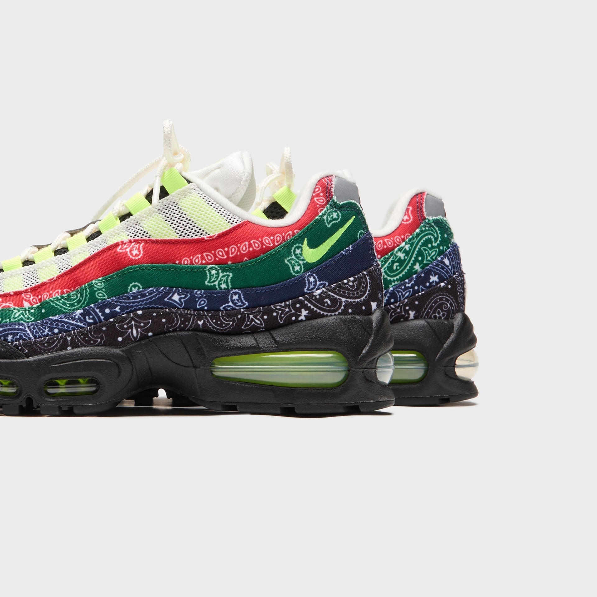 Kith x Nike Air Max 95 bandana, heel view of the pair with layered paisley panels and volt Air sole