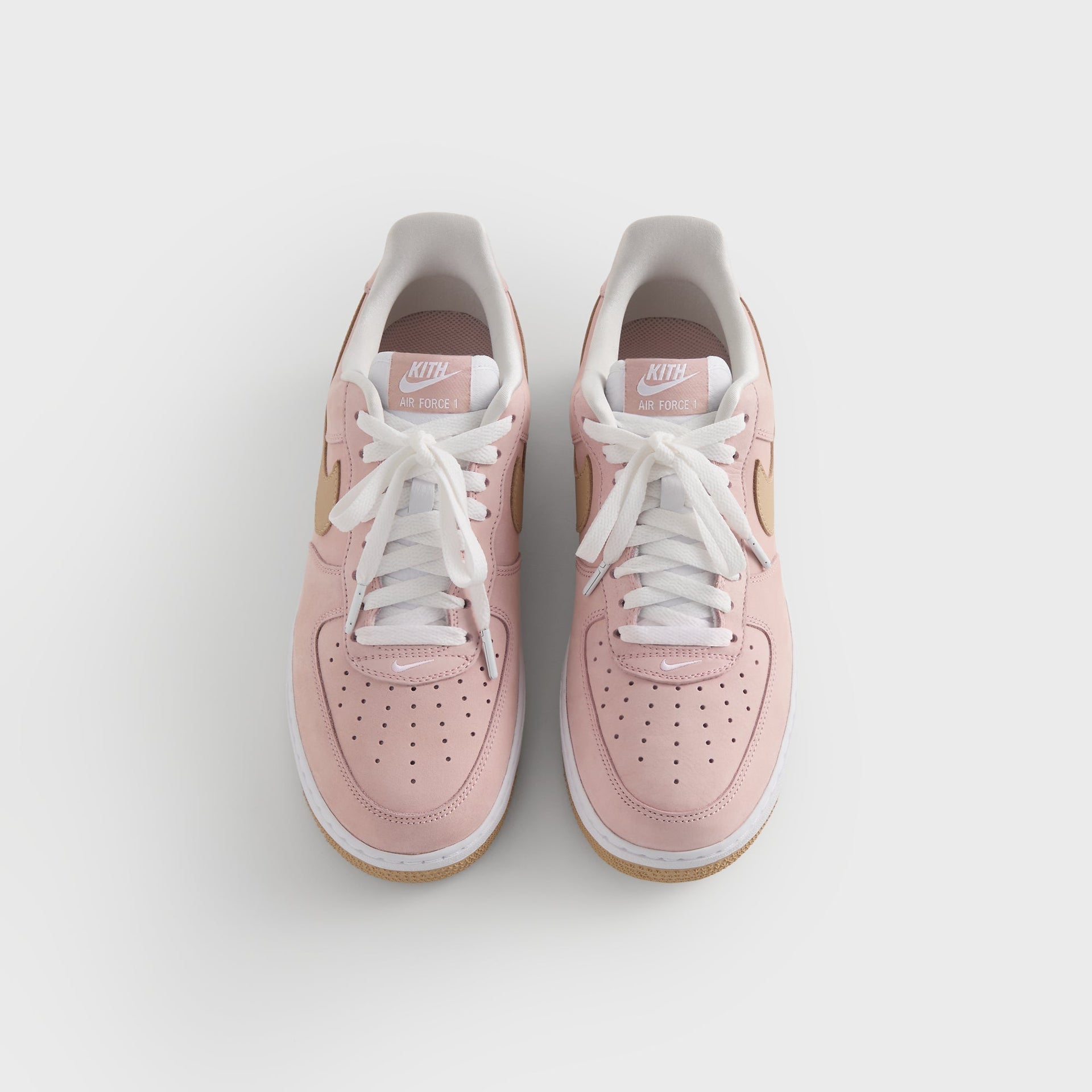 Kith for Nike Air Force 1 'Un-Linen' top-down view of pink pair with Kith Air Force 1 tongue tags
