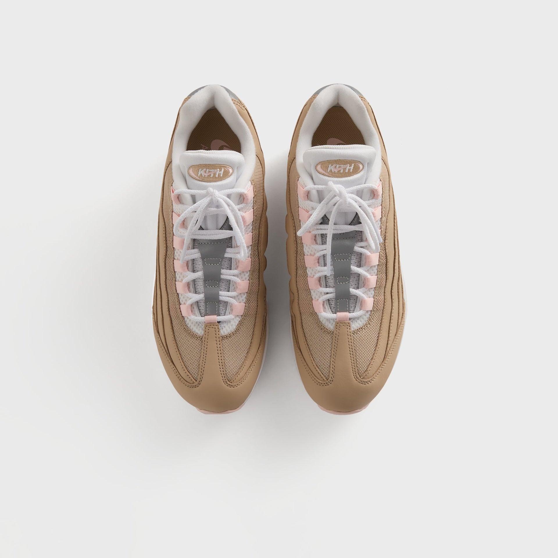 Kith for Nike Air Max 95 'Linen' tongue and lacing close-up with grey Nike flap and pink eyelet accents