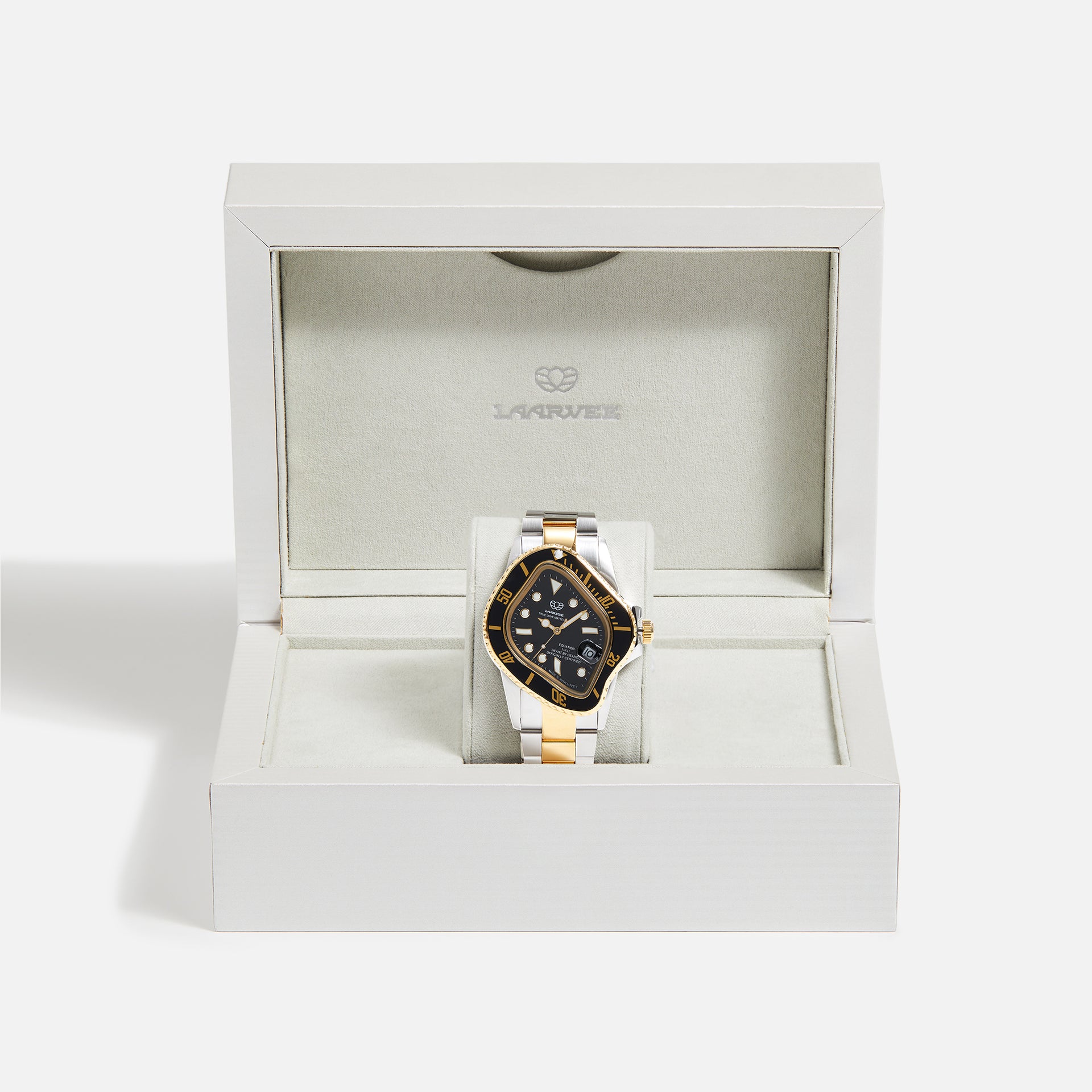 LAARVEE Precision Steel watch resting in white LAARVEE presentation box, black dial, gold-black bezel